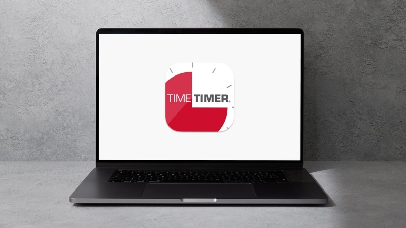 A laptop shows the Time Timer app logo on a white screen against a plain gray background