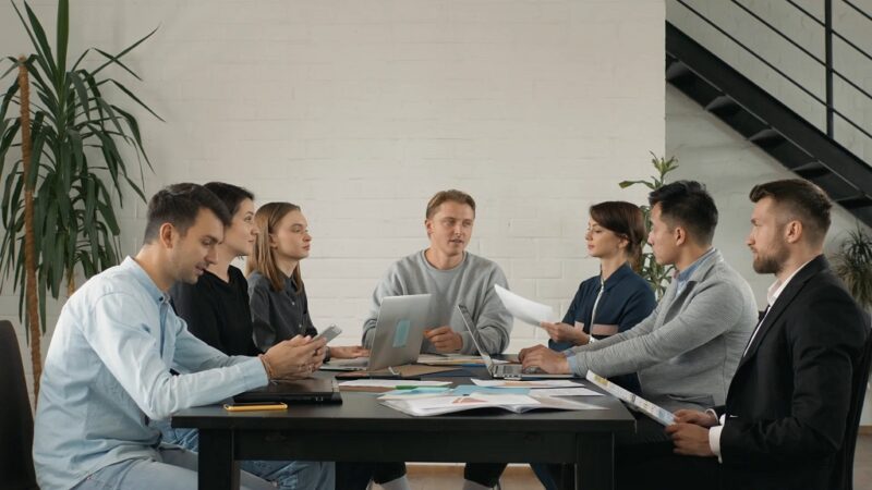 Employee reviewing documents and developing professional skills through workplace training